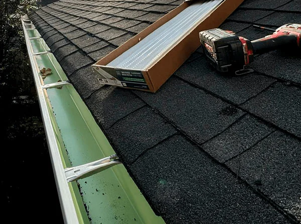 gutter-repair-before-central-nj gutter repair before service showing clogged gutter system in NJ